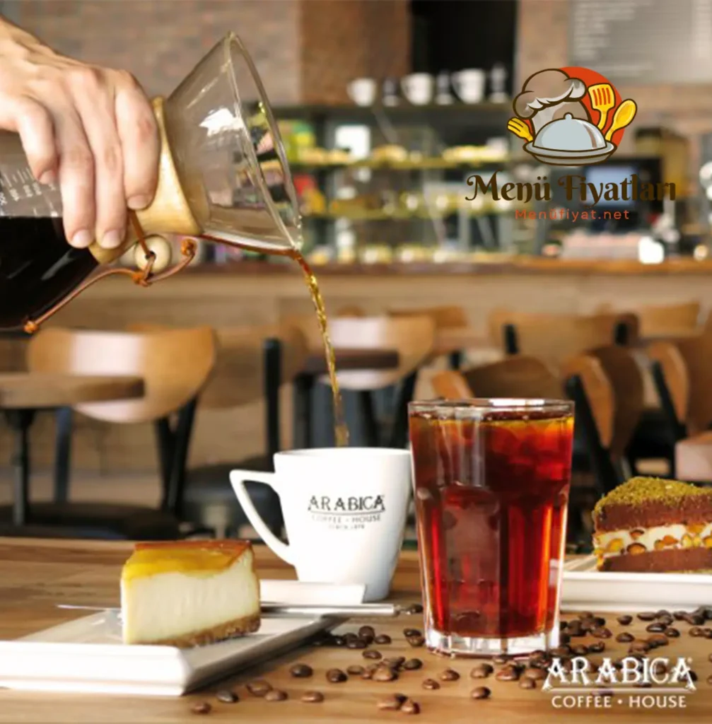 Arabica Menü Fiyatları 2024 - Güncel Menü Fiyat Tabloları - Kahve, dünyanın en çok tüketilen içeceklerinden biridir. Kahve severler, farklı aromaları, tatları ve sunumları denemek için yeni mekanlar arayışındadır. Bu arayışın sonucunda, kaliteli ve lezzetli kahveleri ile dikkat çeken Arabica Coffee House markası ortaya çıkmıştır. Arabica Coffee House, Türkiye’nin 35 şehrinde 110 şubesi ile hizmet vermektedir. Arabica menü fiyatları 2024 yılında da uygun ve cazip seçenekler sunmaktadır. Bu yazımızda, Arabica menü fiyatları 2024 hakkında detaylı bilgi vereceğiz.